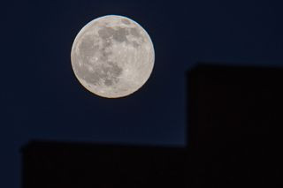 Full moon in a clear winter sky.