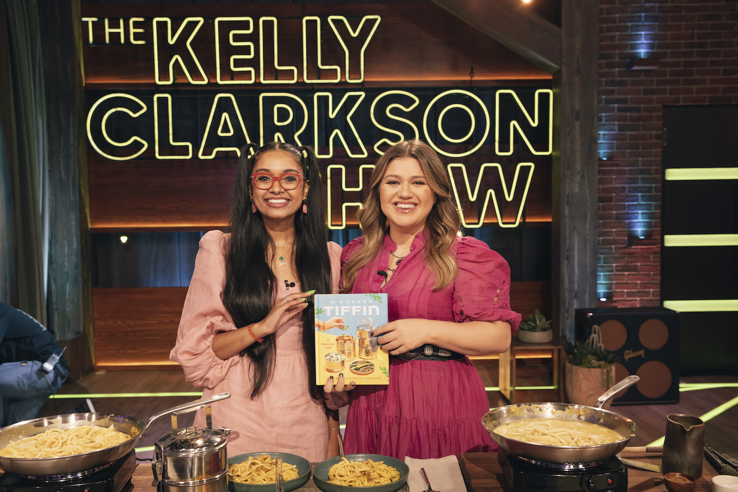 Kelly Clarkson and Priyanka Naik cooking Bucatini a la Pumpkin on The Kelly Clarkson Show.