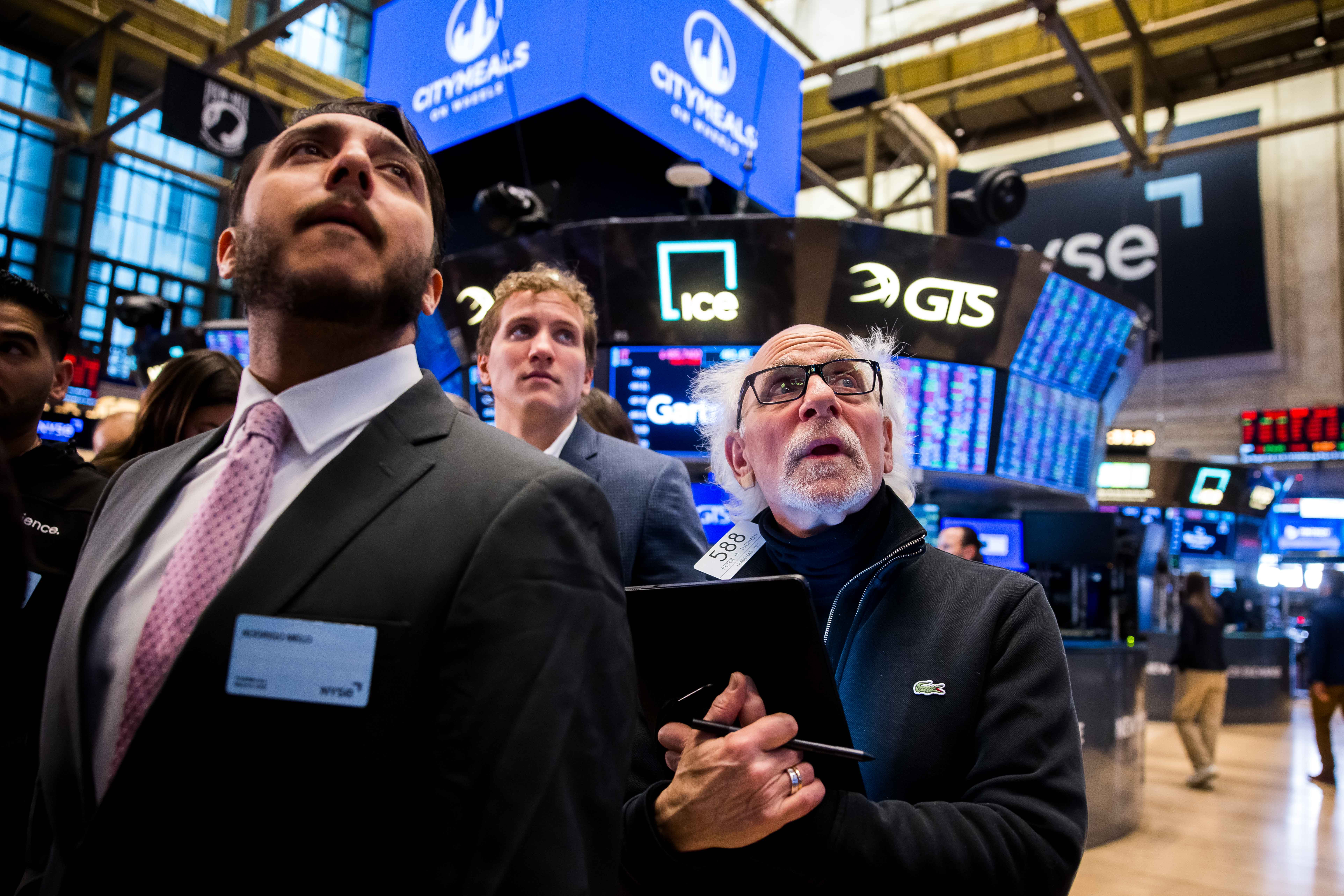 Traders work on the floor of the New York Stock Exchange (NYSE) in New York City, U.S., March 6, 2025. 